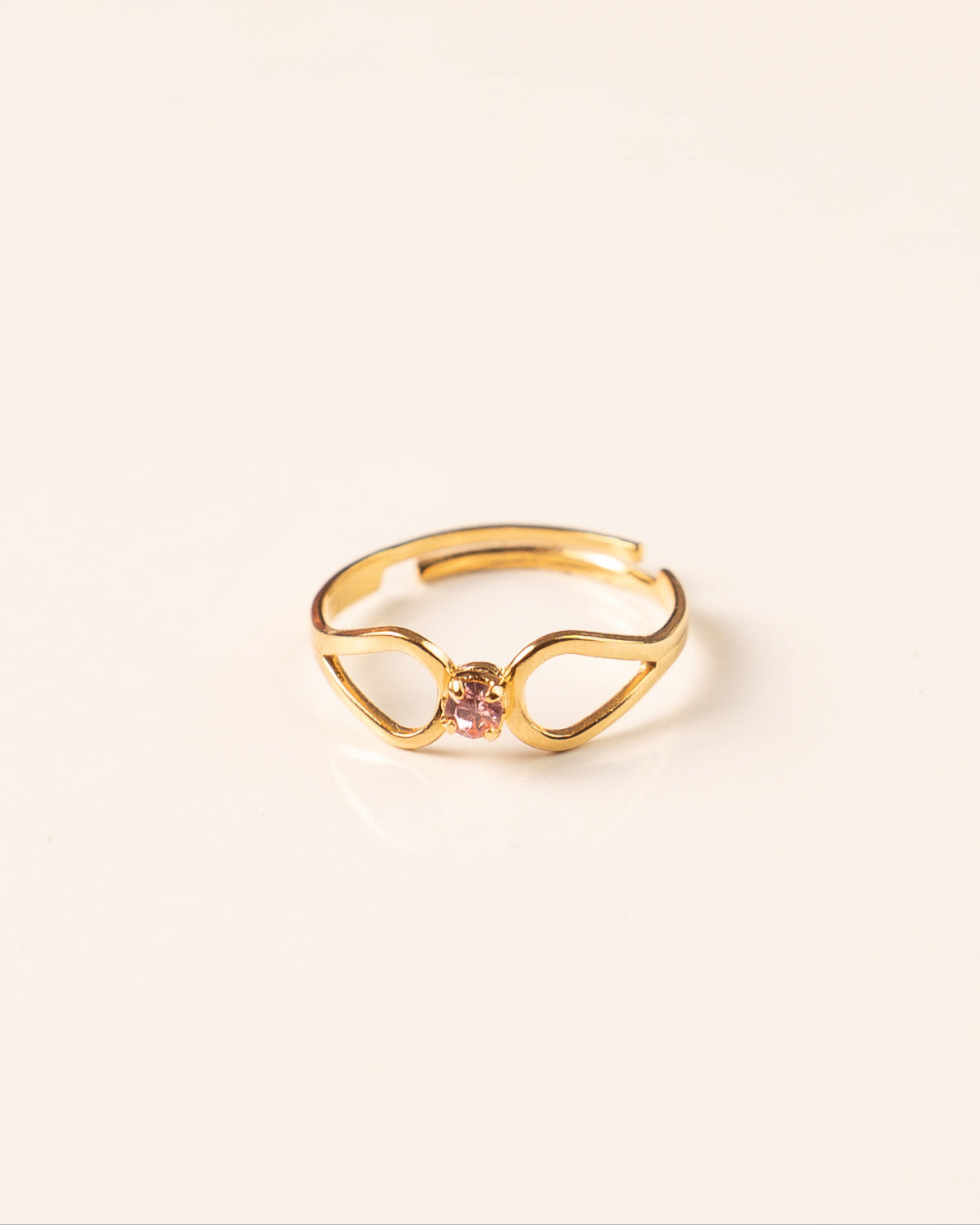 Bague pour femme plaqué or ajustable deux volutes sertis d'un strass rose